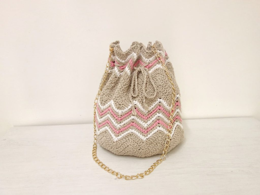 This is a photo of crochet drawstring bucket bag pattern made by gootie