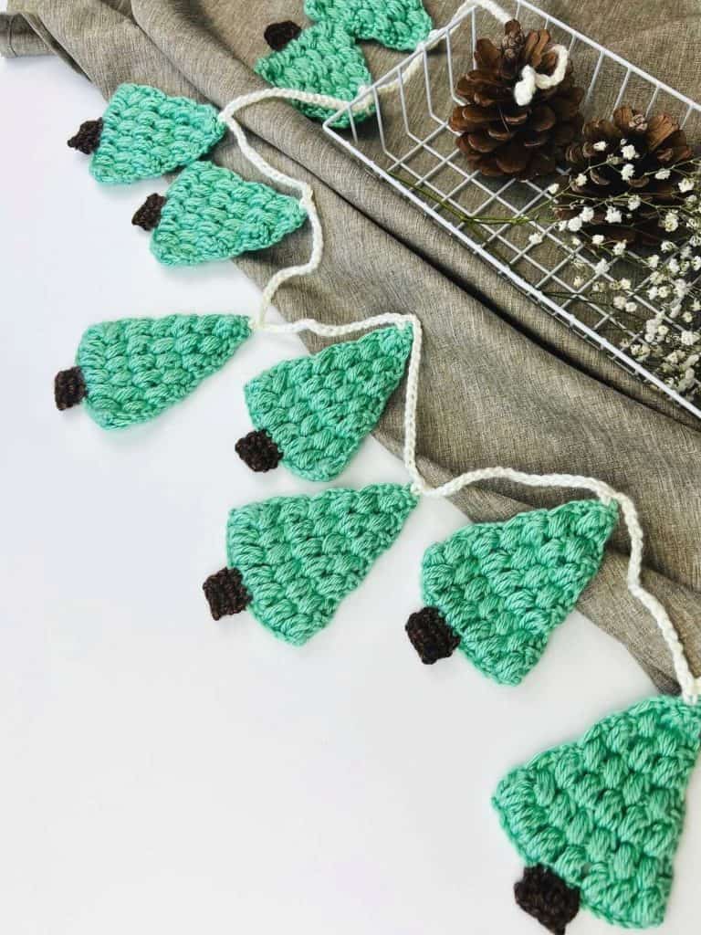 this is a photo of Crochet Christmas Tree Garland free pattern desert blossom crafts
