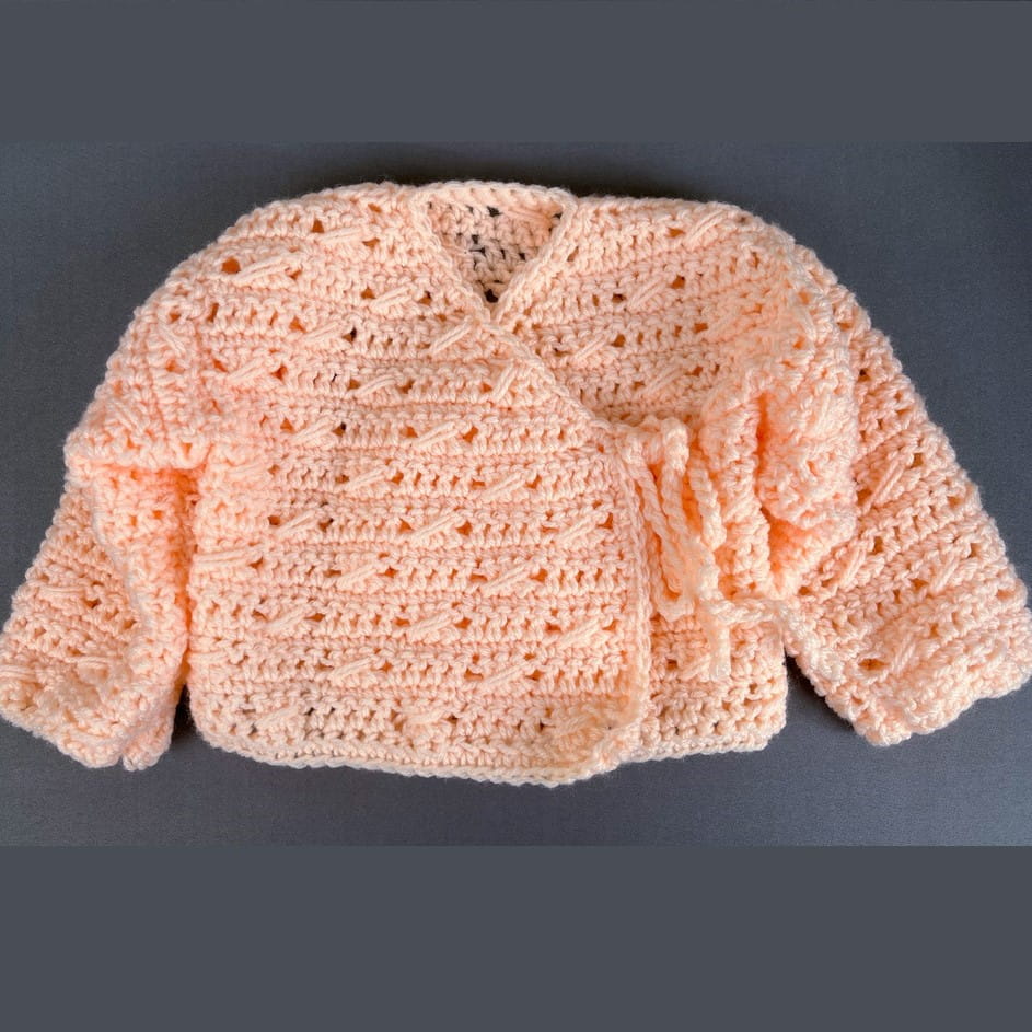 this is a photo of crochet baby sweater free pattern