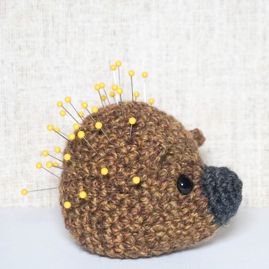 this is a photo of Crochet Pincushion free crochet pattern by Underground Crafter